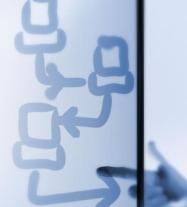 photo of showing hand drawn computers on frosted glass