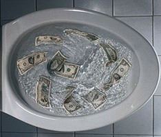 photo of money being flushed away