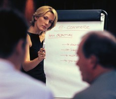 photo of woman at whiteboard