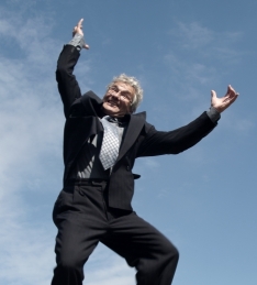 image of retiring man jumping up in the air in glee