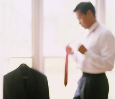 photo of man dressing for a presentation