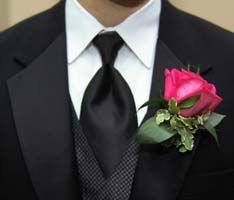 man wearing a red rose