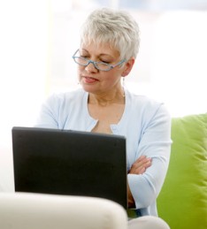 image of lady reading a computer screen